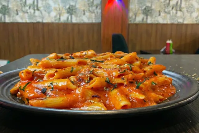 Red sauce penne pasta, tangy and saucy