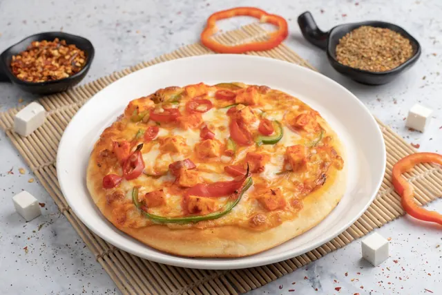Paneer makhani pizza with onion and capsicum